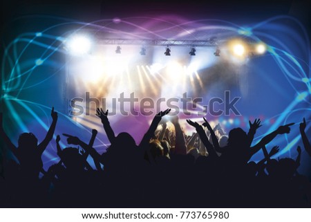

Picture of rock concert, music festival, New Year eve celebration, party in nightclub, dance floor, disco club, many people standing with raised hands up and clapping, happiness and night life 