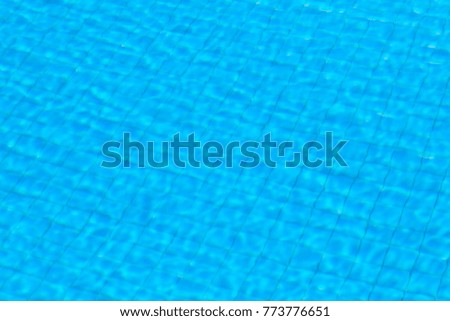 Sparkling blue pool surface on a sunny day