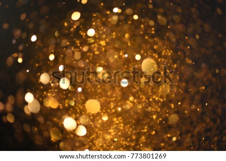 golden glitter texture Colorfull Blurred abstract background for birthday, anniversary, wedding, new year eve or Christmas.