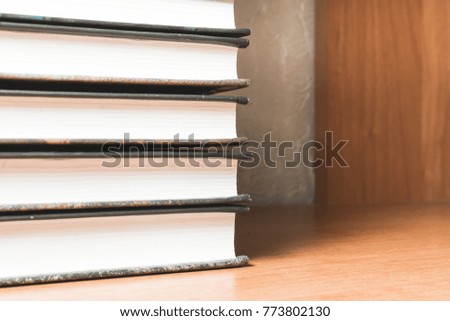 School books for education lie on the shelf.