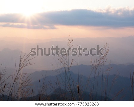 Beautiful sun set at Doi Tu Lay (Tu Lay Mountain) with layers of mountains background, Tak province, Thailand