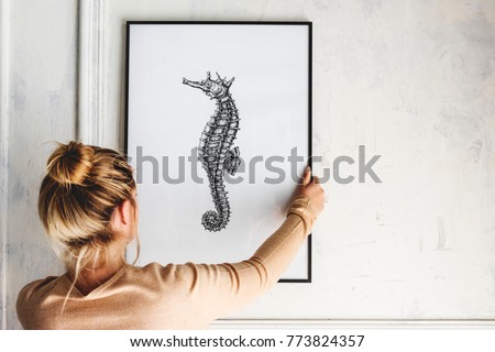 Photo of hand drawing seahorse is hanging on the wall Royalty-Free Stock Photo #773824357