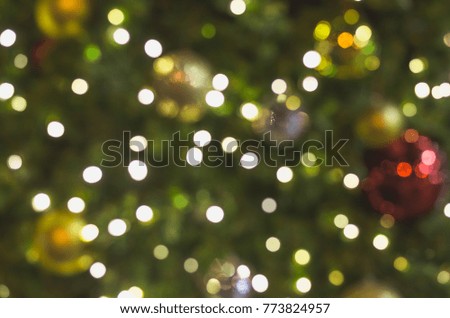bokeh or defocused of decoration lighting on pine tree for merry christmas and happy new year.