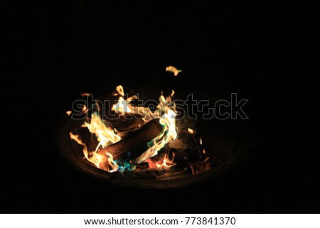 Colored powder Campfire with blue and green flame from color changer powder