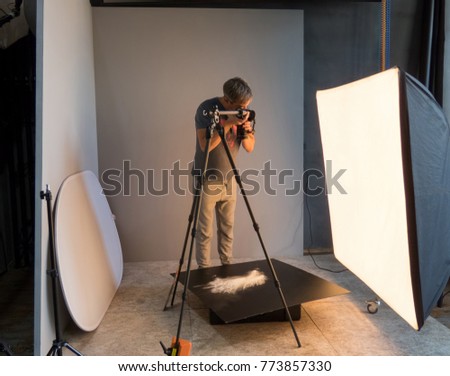 photographer working in the studio. unintended photography