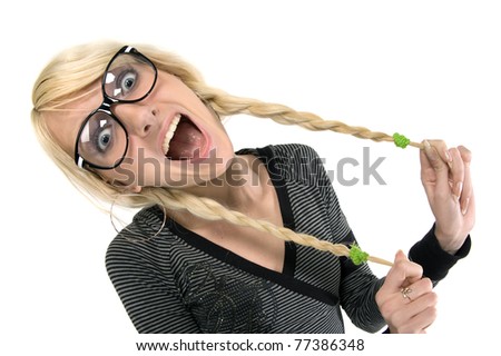 Happy and smart young blond woman with funny glasses and plait looks like nerdy girl. Smiling and looking at camera, humor style on white background.