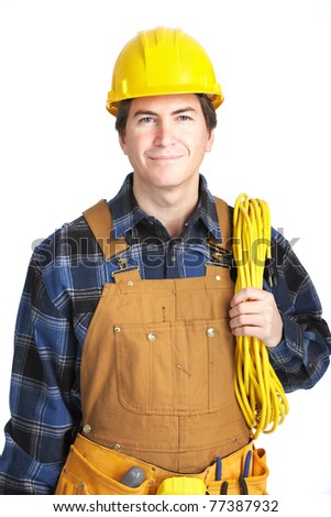 Young handsome electrician in yellow uniform. Over white background
