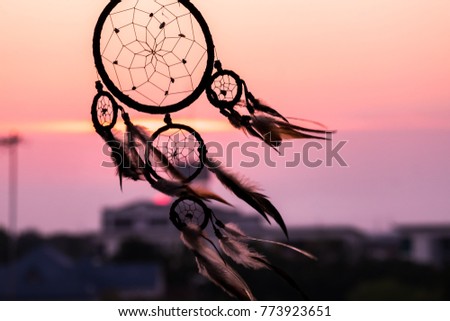 Dream Catcher on the sunset background Royalty-Free Stock Photo #773923651