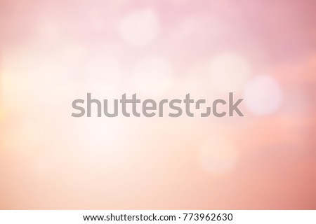abstract blurred beautiful pink and blush gradient color sky background with double exposure of bokeh light and glowing flares filter effect for design concept