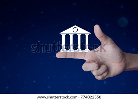 Bank icon on finger over fantasy night sky and moon, Business banking online concept