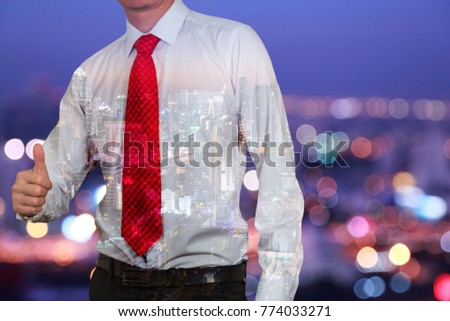 Double exposre of businessman give a thumbs up for compliment on bokeh light night urban background as praise, congratulate, good and like concept.