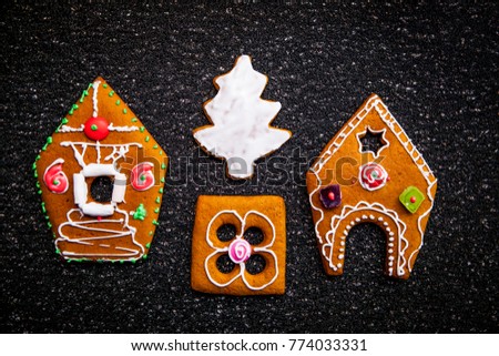 Beautiful gingerbread house. The design of the biscuit. Beautiful traditional winter cookies. Gingerbread house with icing.