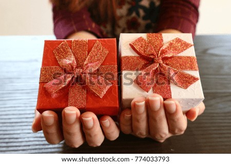 Gifts box on women 's hand,Christmas concept.