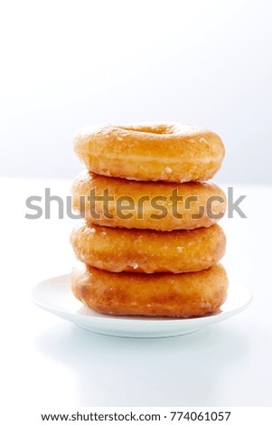 Donut isolated on a white plate in white background