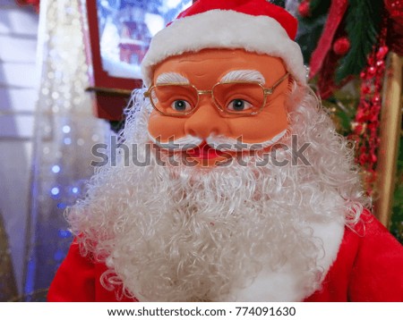 Happy Santa Claus in eyeglasses looking at camera