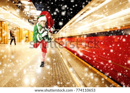 Christmas time and green elf with train 