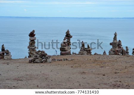 several mounds of pebbles, piled stones of Cap Fréhel, Brittany, Côtes d'Armor, Côte de Granit Rose, France