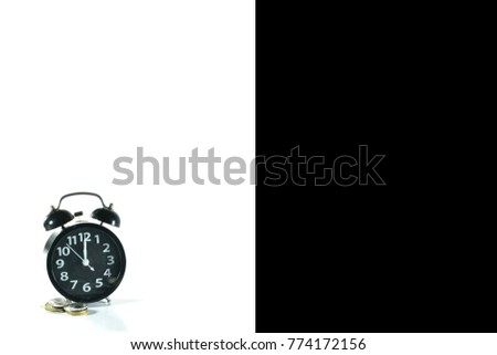 Clock with coins in concept black Friday on Half background white and black 