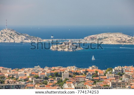 Views of Marseille and famous If castle, chateau d'If from the church of Notre-Dame de la Garde on a beautiful summer day.
