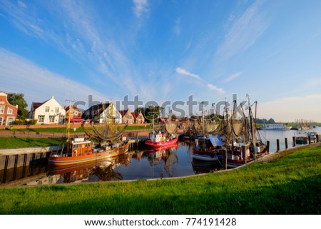 The fishing harbor of Greetsiel/Germany Royalty-Free Stock Photo #774191428