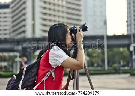 Female photographer in the city