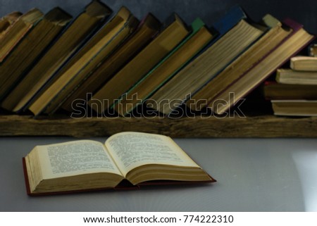 Old books on a wooden table. Beautiful background.