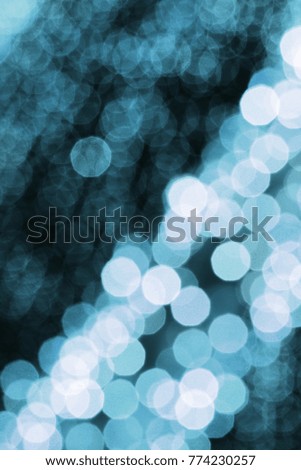 Abstract, colorful, blurry christmas background. Glowing and sparkling lights during night