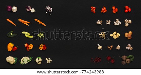 Collage of assorted vegetables isolated on black background. Whole and cut cooking ingredients for sald or soup. Vegetarian food, vitamins and eating right concept, top view, copy space