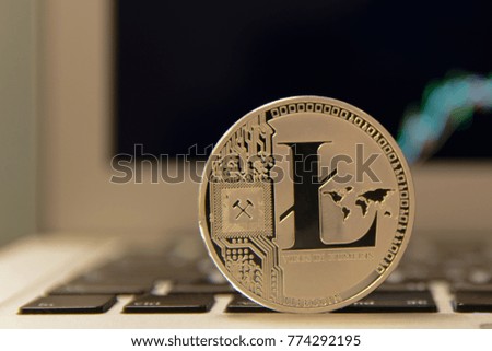 Silver Litecoin on notebook keydoard