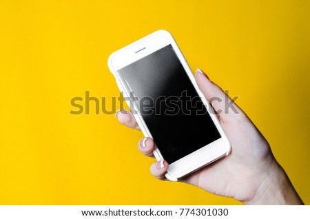 smartphone in hand on the background