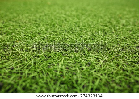 Green artificial grass soccer field. The green background. High quality photo