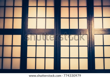 Wooden doors with small glass windows