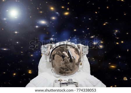 Astronaut makes selfie in the outer space. The elements of this image furnished by NASA.
