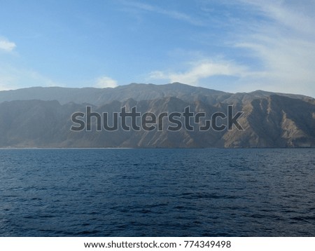 Sea of Oman and Hajar mountains