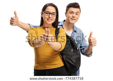Teenage students making thumb up gestures isolated on white background