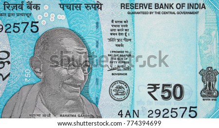 Mahatma Gandhi face on India 50 rupee (2017) banknote close up, Indian  money closeup Royalty-Free Stock Photo #774394699