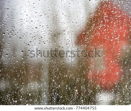 View of house through window with drops 