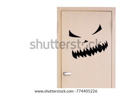 Isolated on white wooden door with black angry scary monster face.  Concept of phobia or fear . 