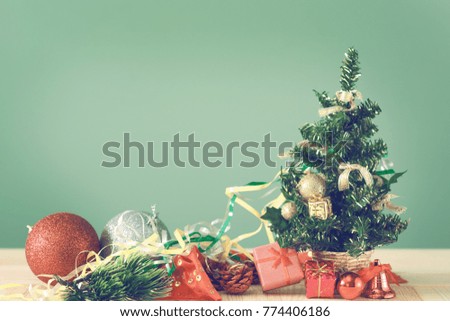 Festive Christmas tree stands on light boards. Christmas background. Christmas decorations on a green background. Space for text. New Year's background. Toned image.
