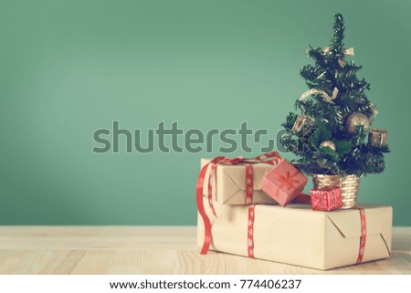 Festive Christmas tree stands on light boards. Christmas background. Christmas decorations on a green background. Space for text. New Year's background. Toned image.