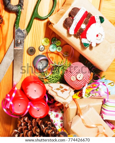 lot of stuff for handmade gifts, scissors, ribbon, paper with countryside pattern, ready for holiday concept, nobody home 