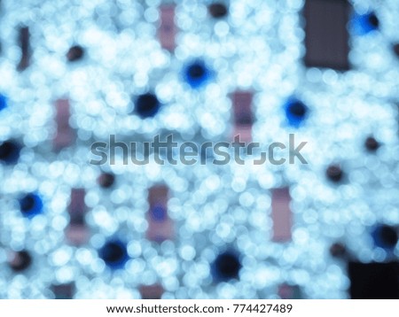 Blurred photo of Colorful Christmas Tree Bokeh background of defocused glittering lights, Christmas background.
