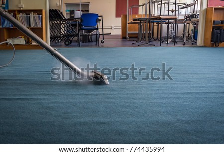 Professional Steam Carpet Cleaning using a Wand Royalty-Free Stock Photo #774435994