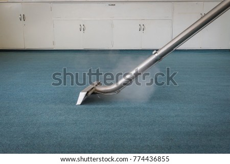 Carpet Steam Cleaning - Professional Carpet Cleaning with Wand Royalty-Free Stock Photo #774436855