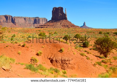 Monument Valley is a region of the Colorado Plateau characterized by a cluster of vast sandstone buttes above the valley floor. It is located on the Arizona-Utah state line, USA