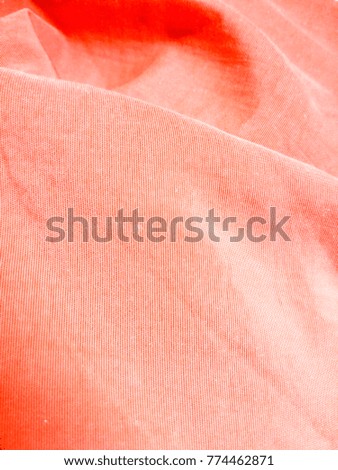 Stitching on orange cloth