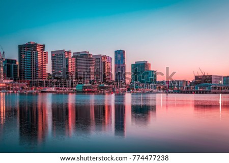 Docklands, Melbourne residential buildings and Yarra waterfront at dawn