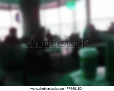 People in coffee shop blur background