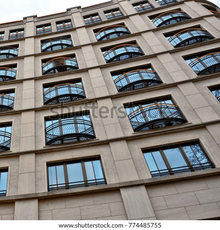 Skyscraper. Windows. Modern exterior of architectural building. City life. Megalopolis. Panoramic skyline. Aerial view. Close up. 
