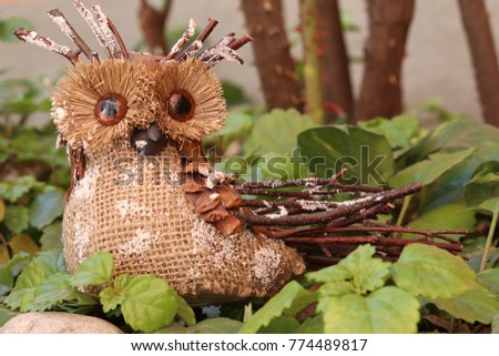 Wooden owl on a garden
